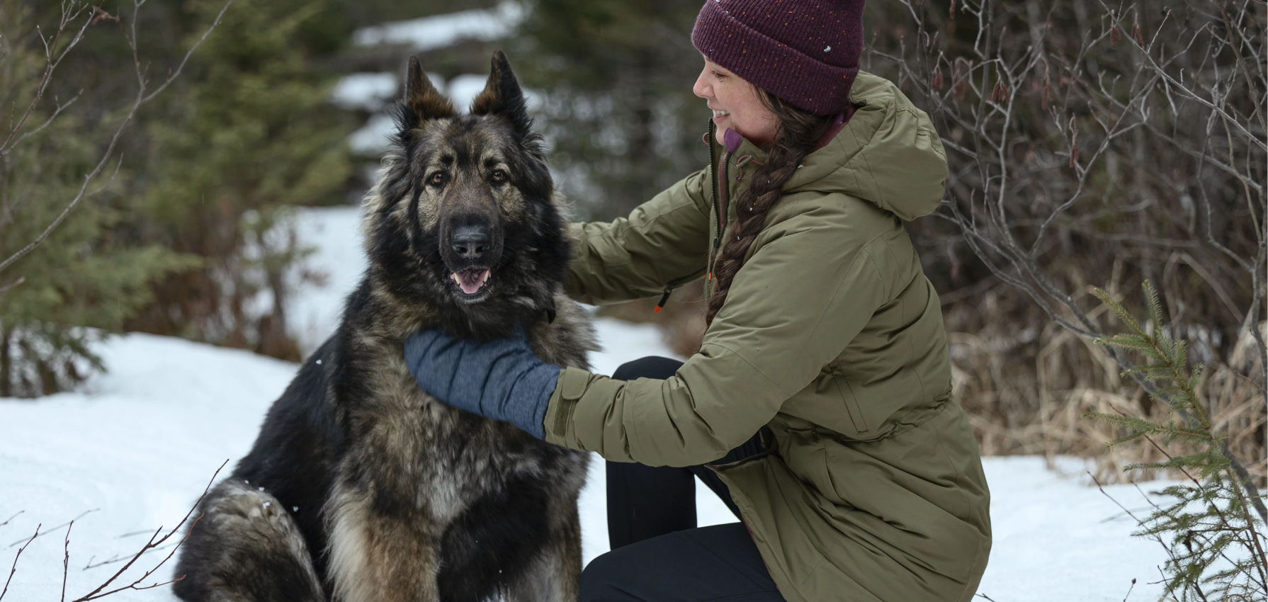 Woman sitting next to dog